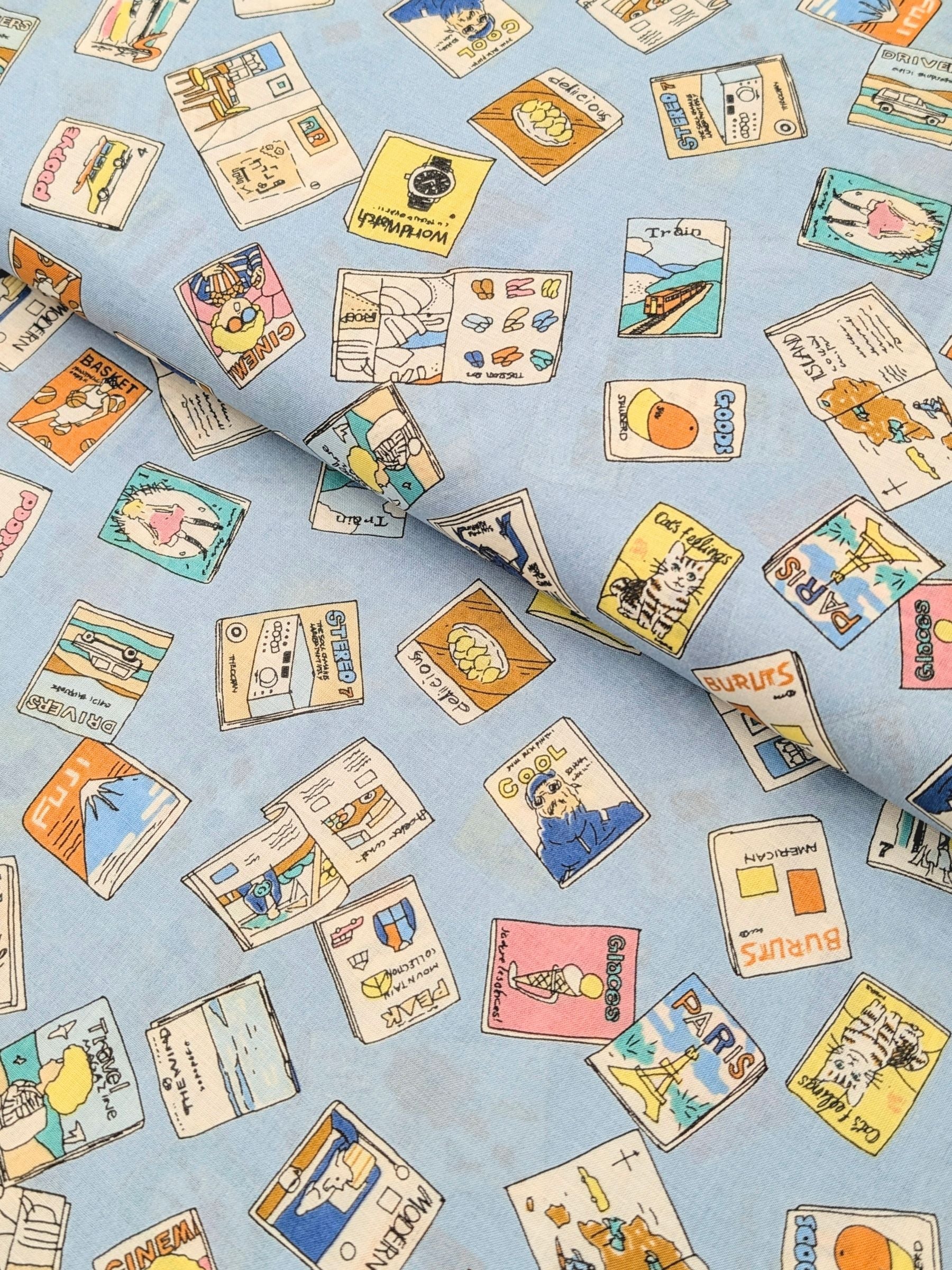 Hokkoh - Retro Magazines Cotton Lawn Fabric - Light Blue