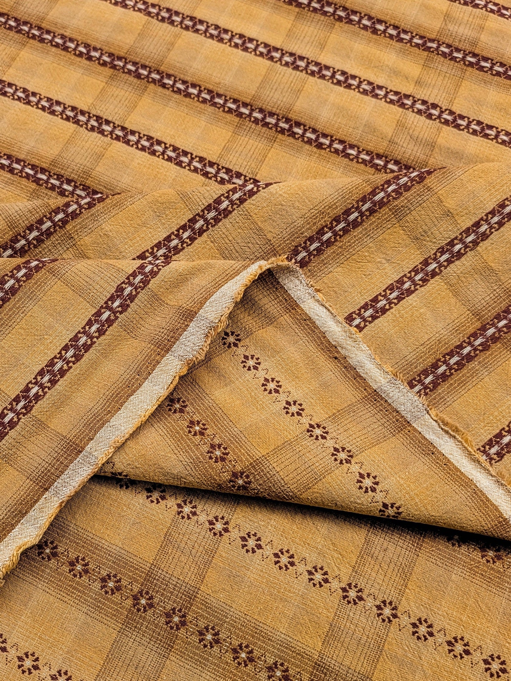 Close-up of patterned fabric with brown and beige colors